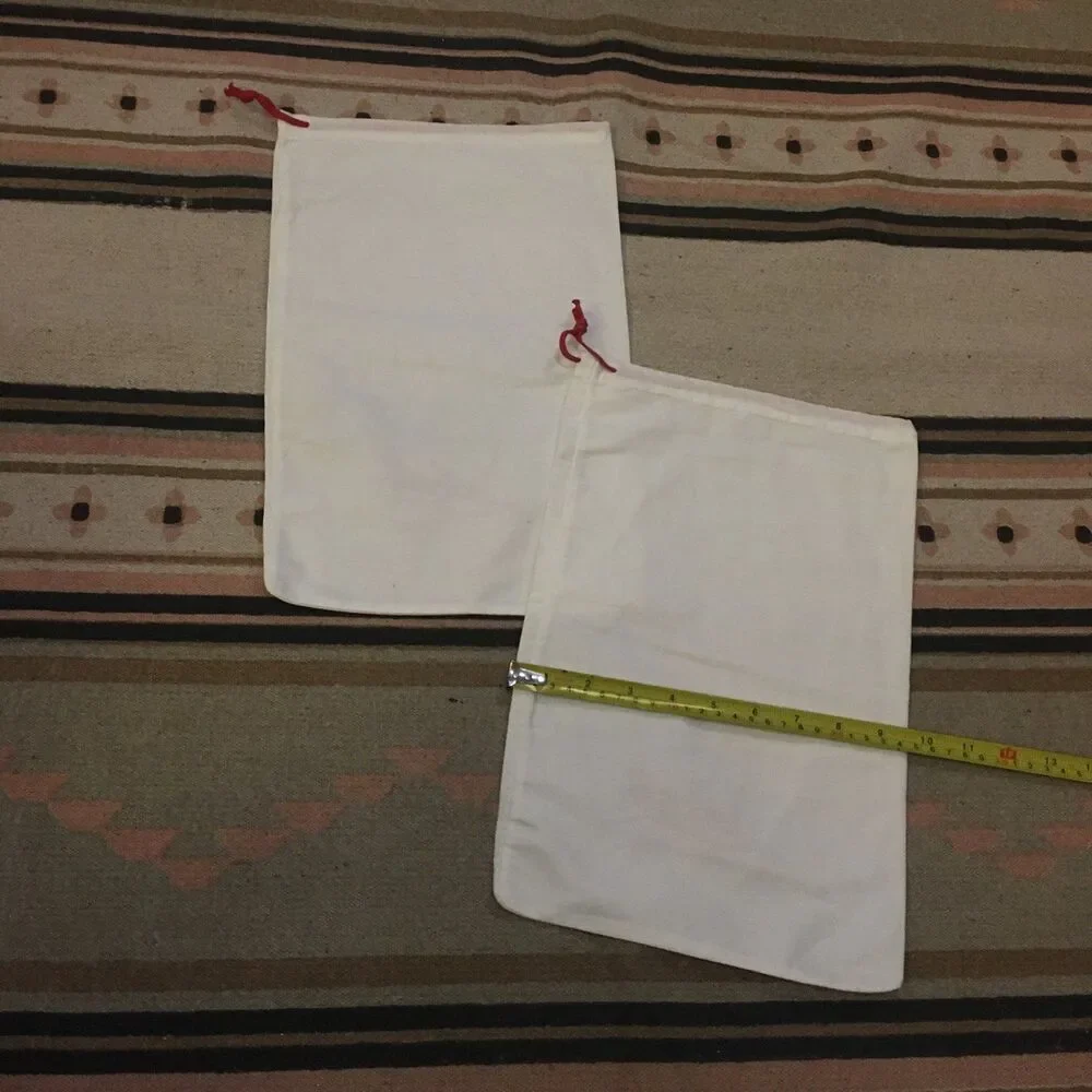 Two (2) Christian Louboutin Paris white w/ red letters & drawstring Dustbag